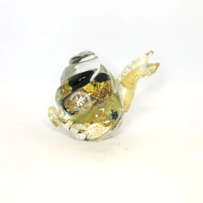 Handmade Maltese glass snail ornament with gold accents and clear glass body.