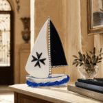 Hand-blown Maltese glass sailboat, crafted by artisans in Malta, showcasing traditional glassmaking.